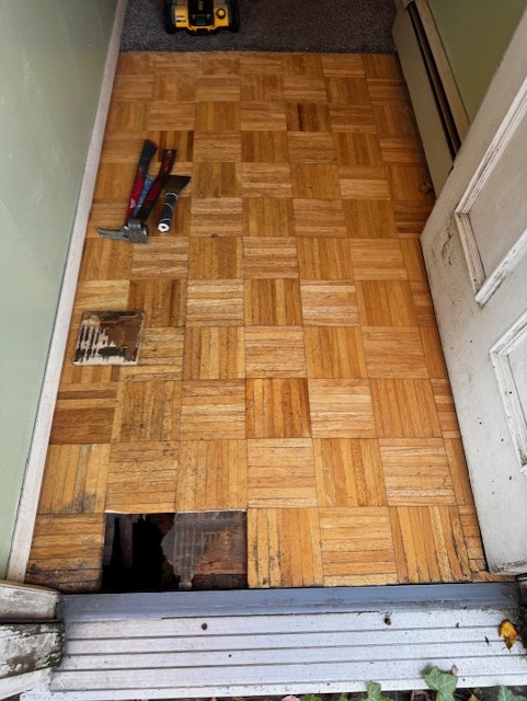 Damaged floor before repair